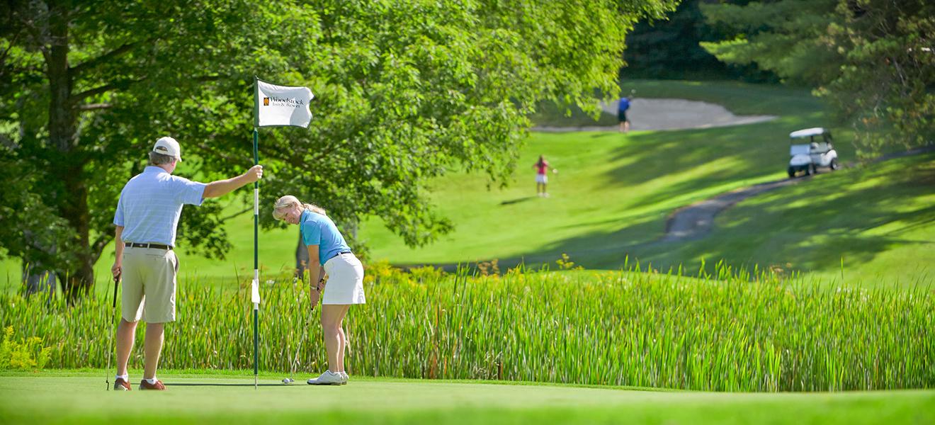 Guests playing golf near our hotel in Woodstock, VT