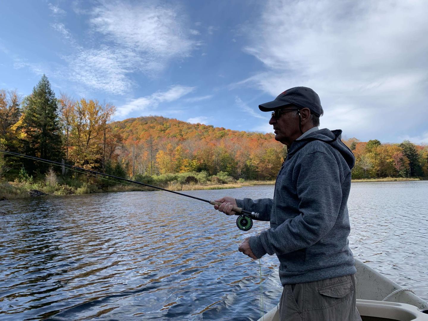 Pond Fishing by Boat