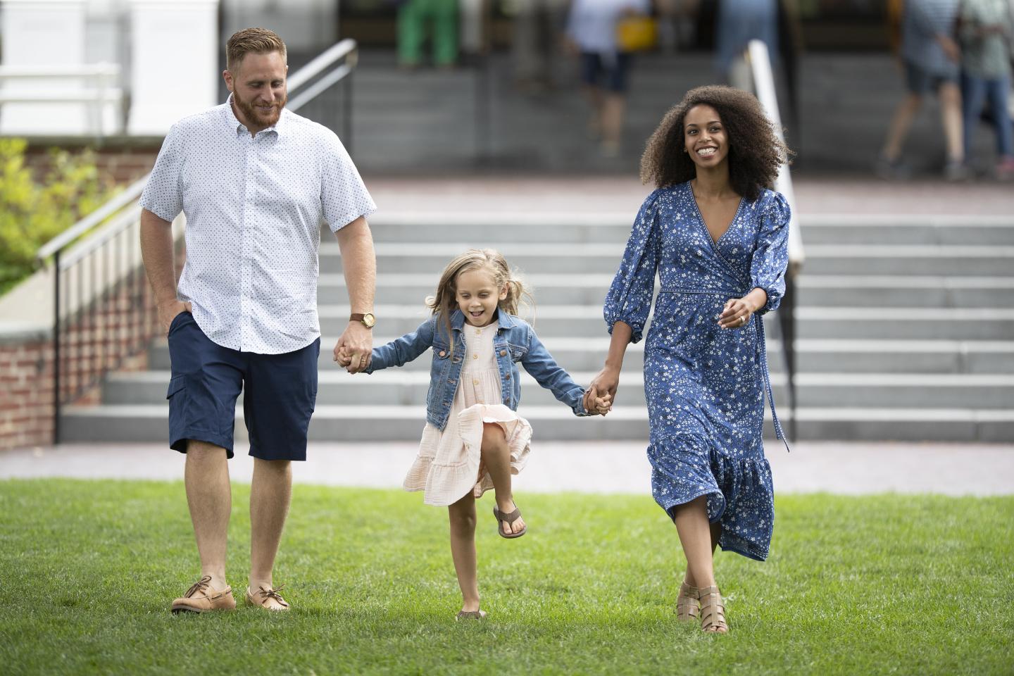 Family strolling on the front lawn