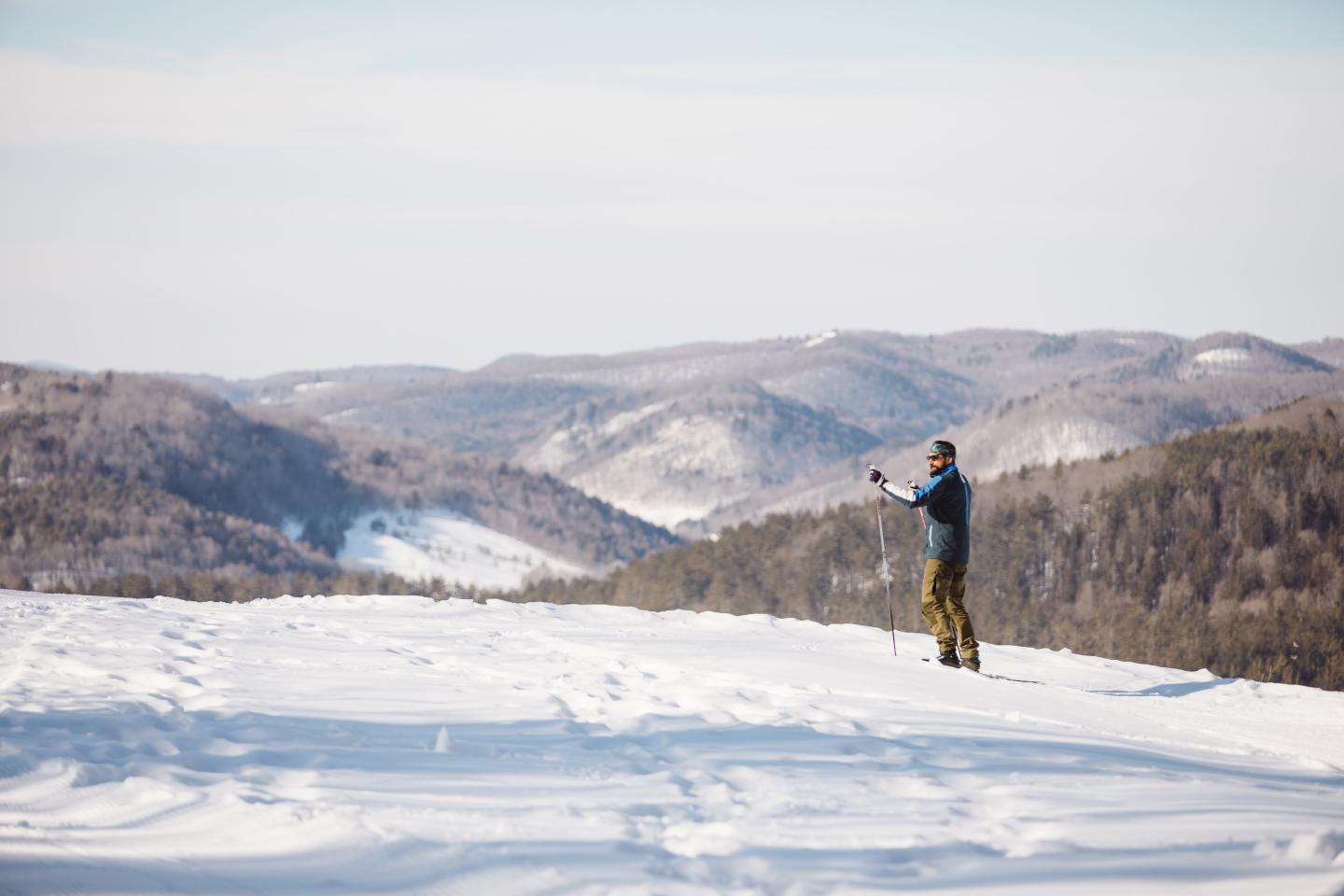 Skier on Mt Peg with mountain view