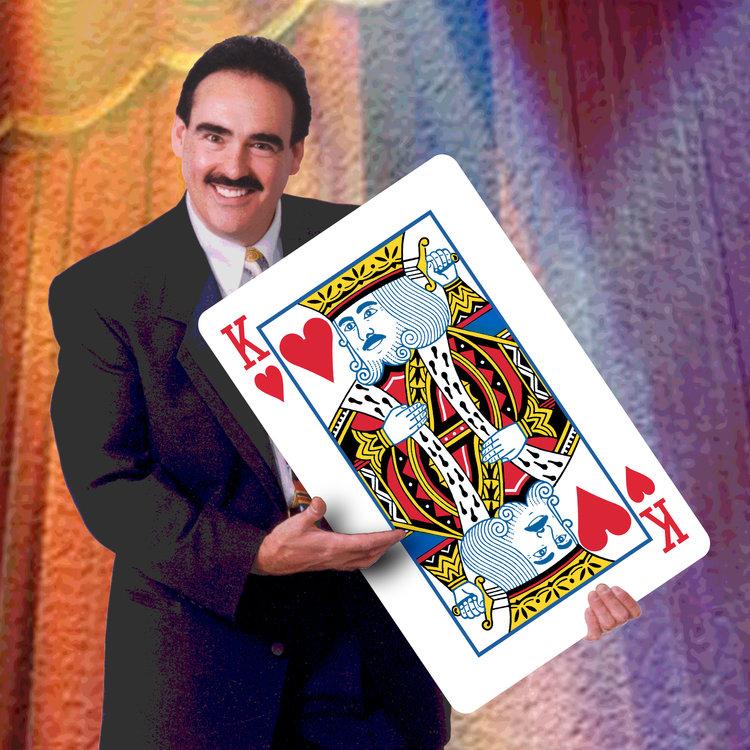 Marko the Magician with a giant playing card