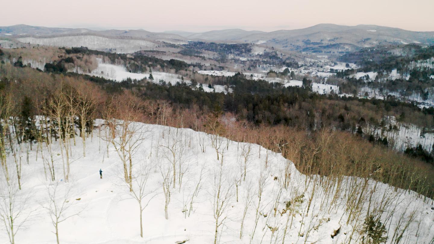 drone view of nordic skier on Mt Tom peak