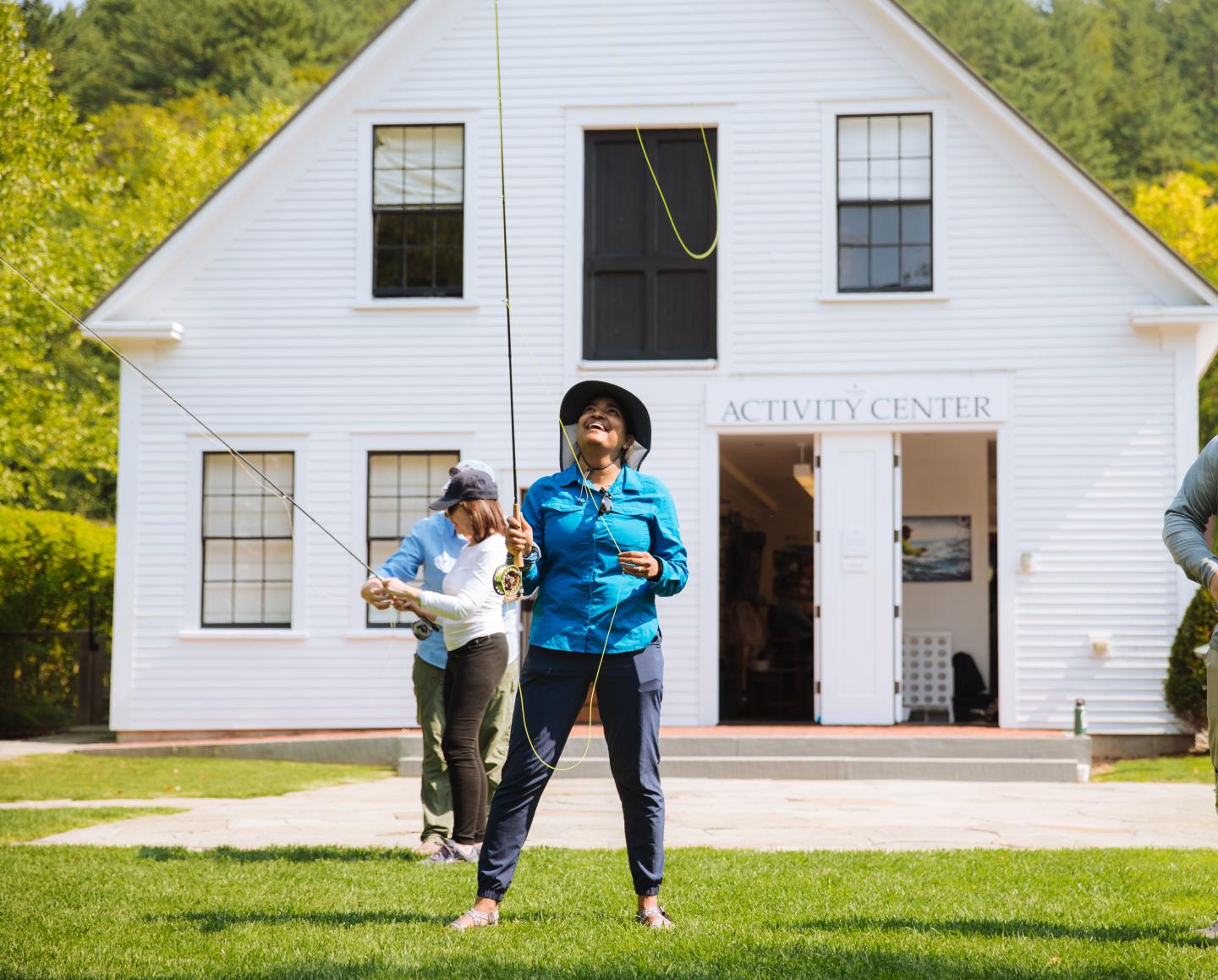 Woman learning to fly cast at the Activity Center