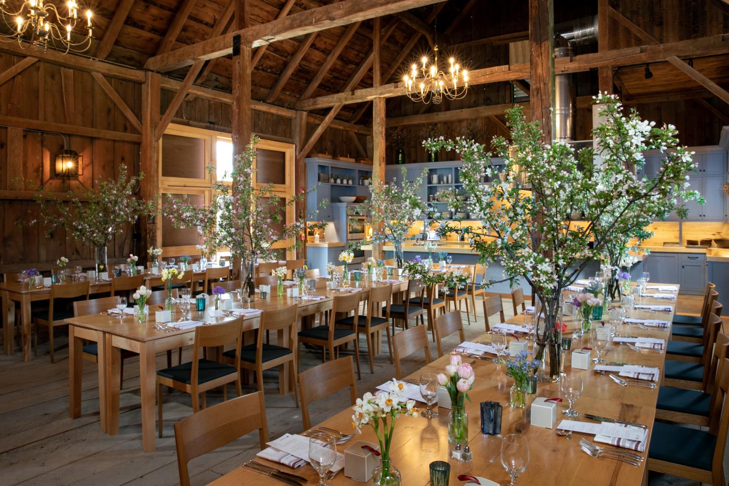 Red barns with spring florals set on tables