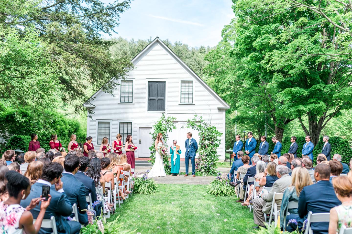 wedding ceremony on the paul barn lawn at the woodstock inn