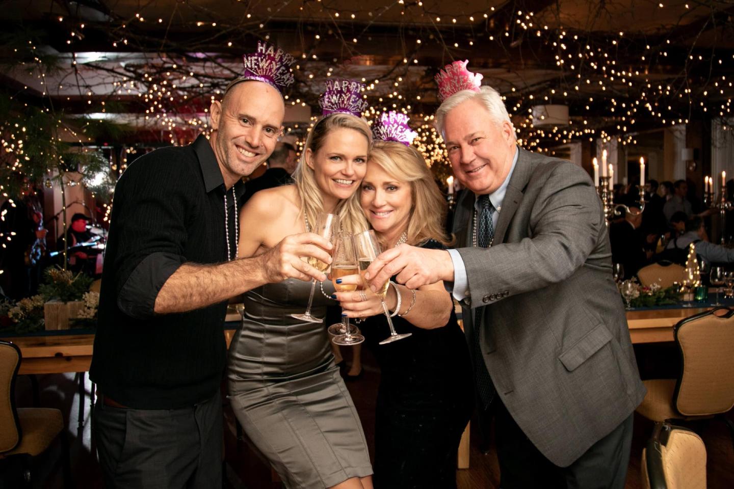 People toasting glasses, celebrating the New Year