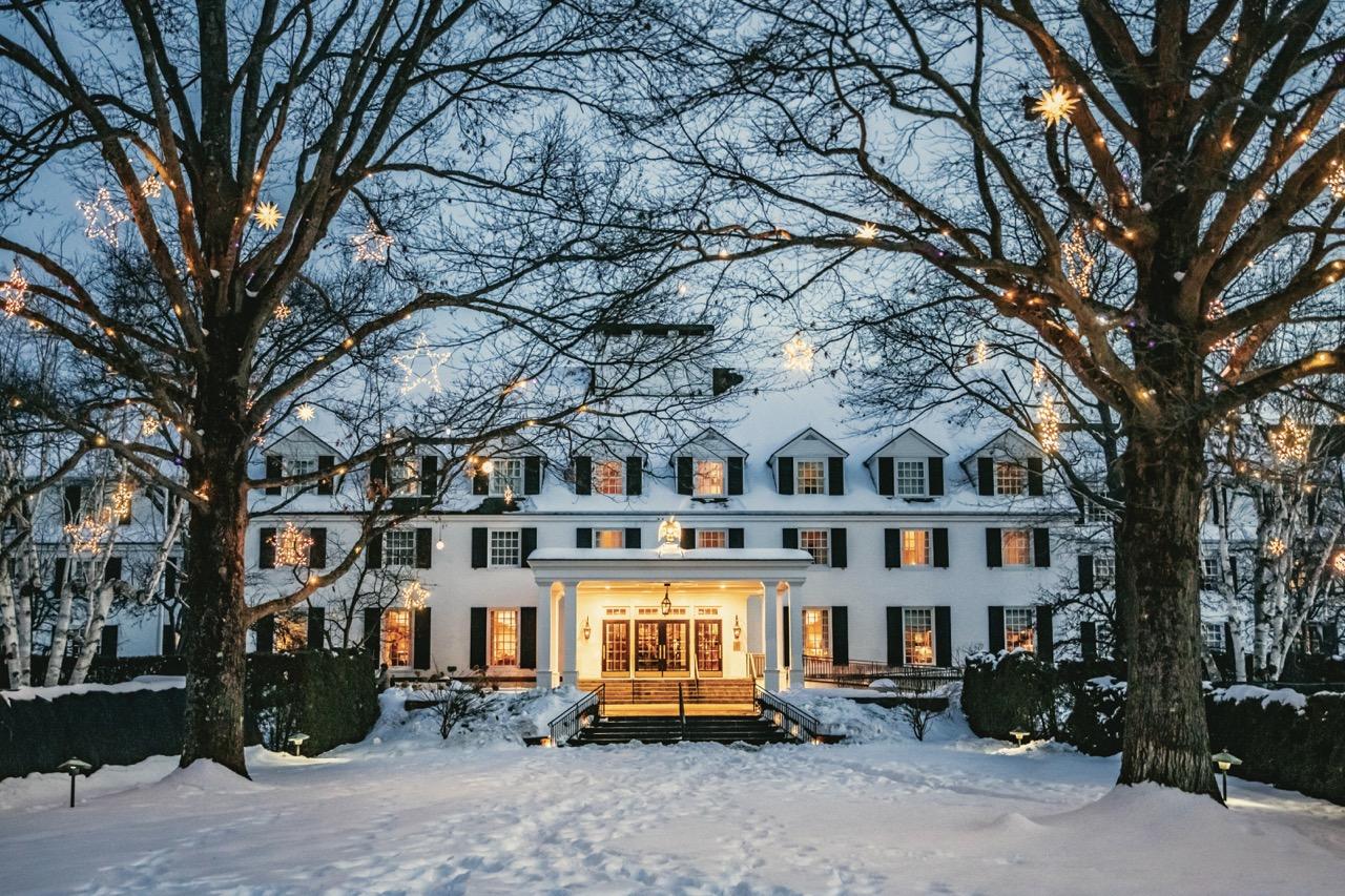 Front of the Inn with snow and holiday lights