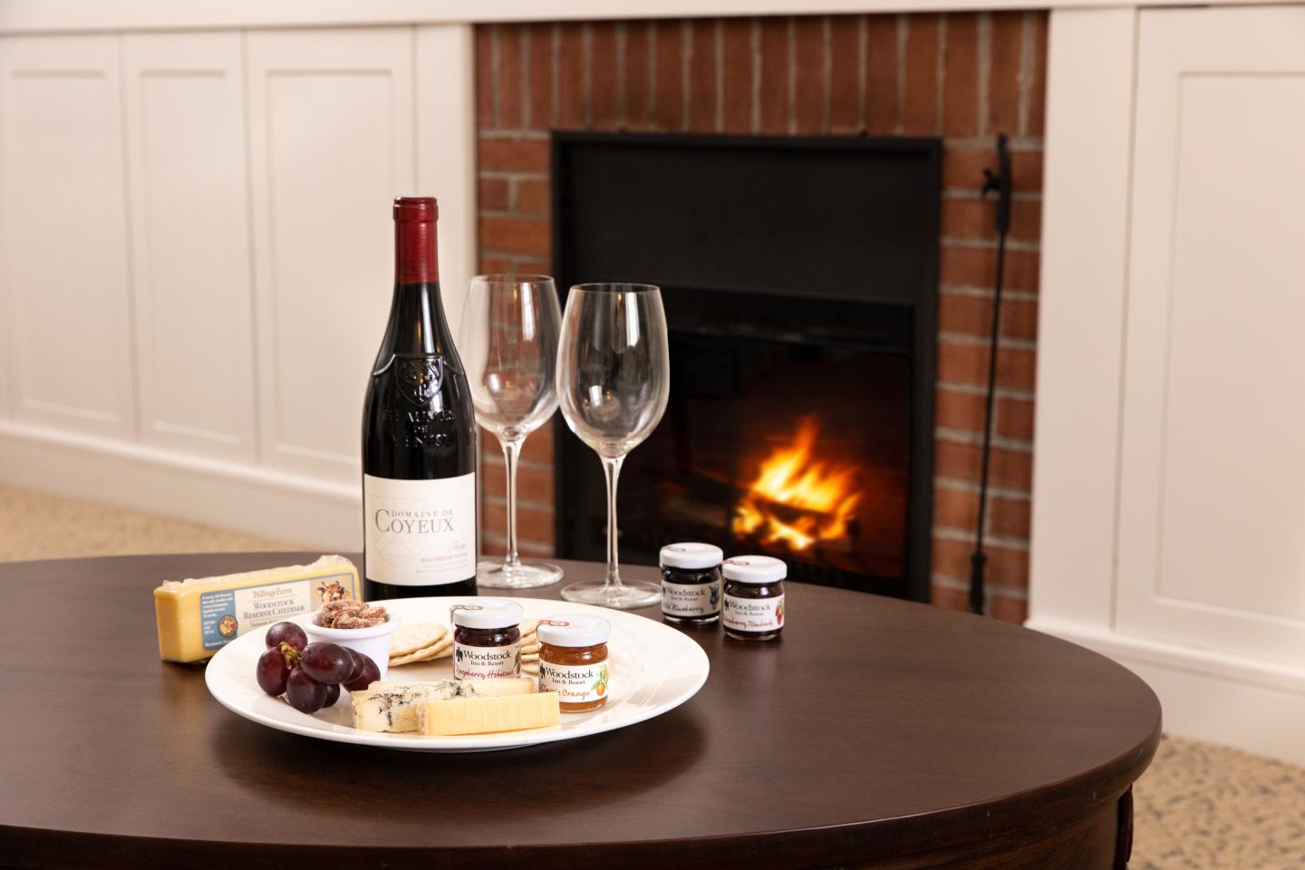 Woodstock Inn room with fireplace and cheese plate amenity