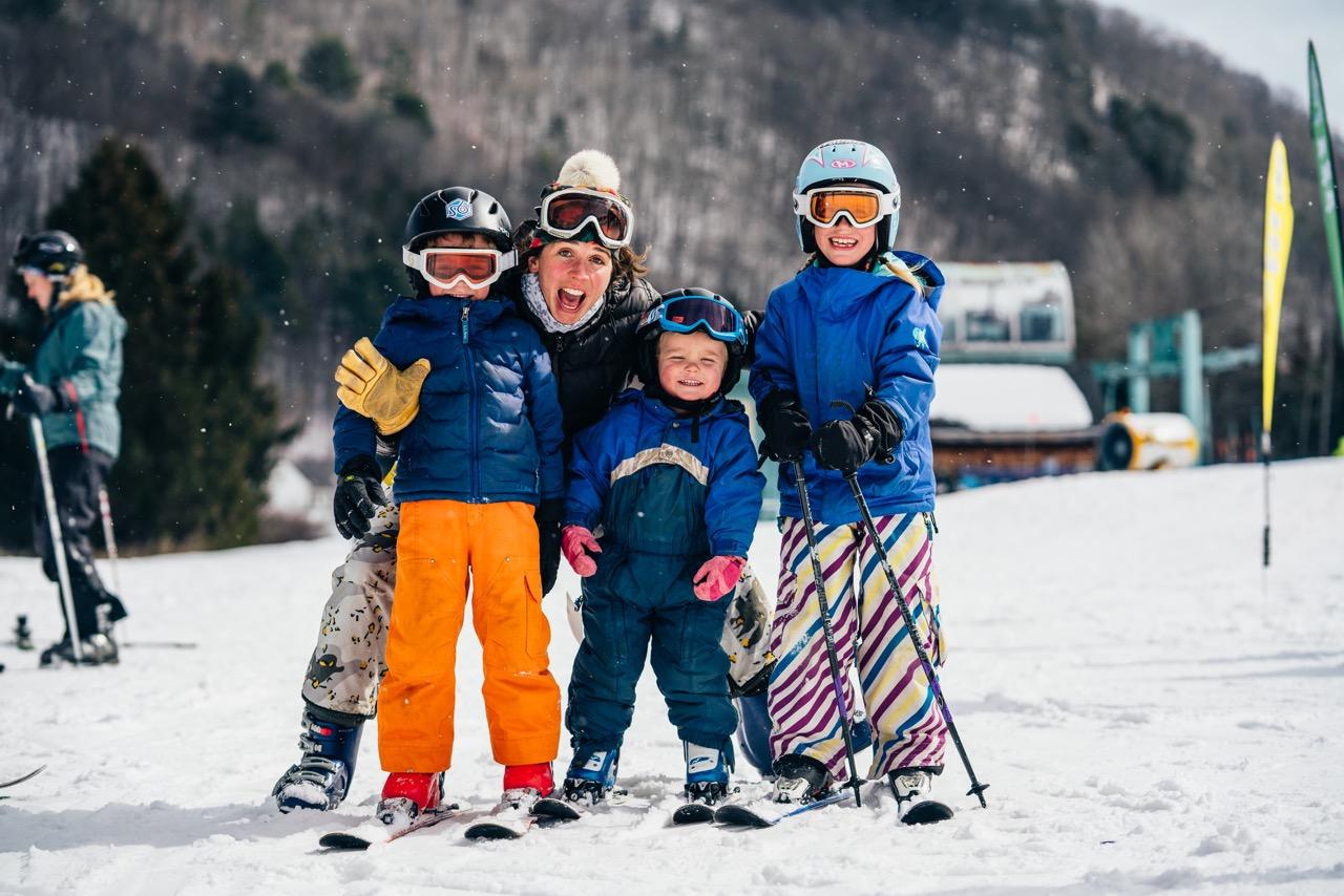Family in Ski Gear Smiling at Saskadena Six Ski Area