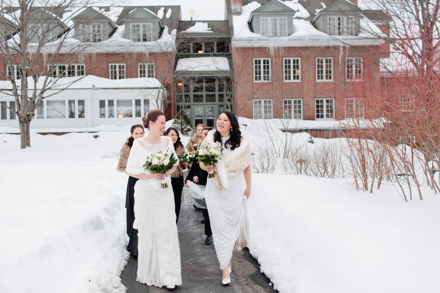 Two Brides Walking with the Wedding Party