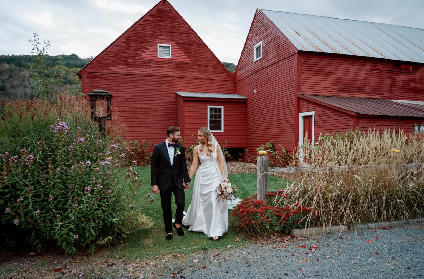 Bride and Groom in front of the Red Barns at Kelly Way Gardens