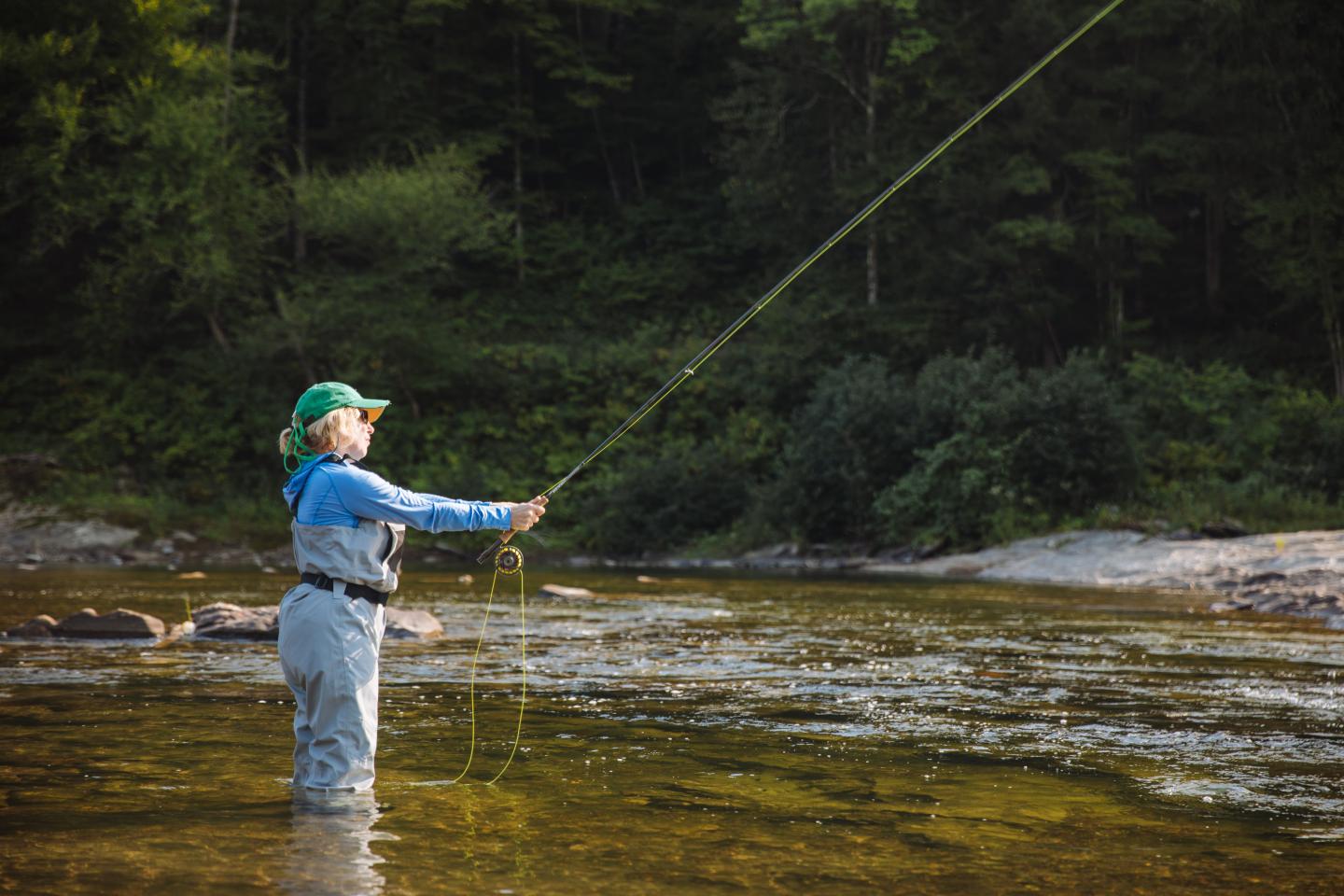 Woman fly fishing 