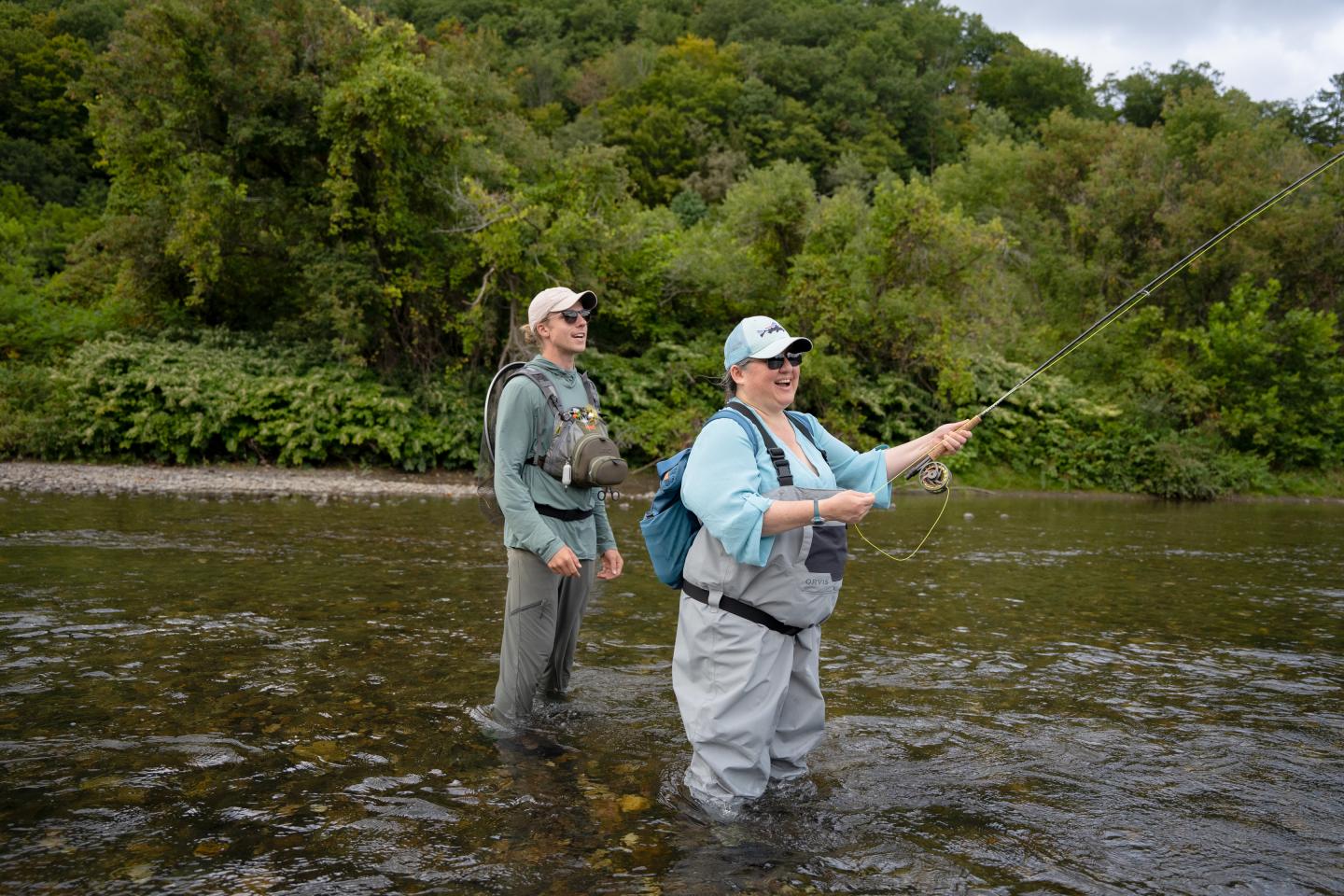 Fly fishing guide and client