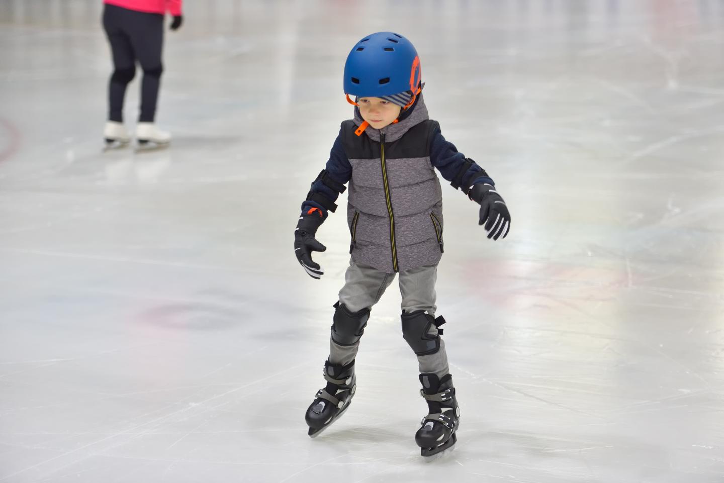 Child Indoor Skating with helmet on