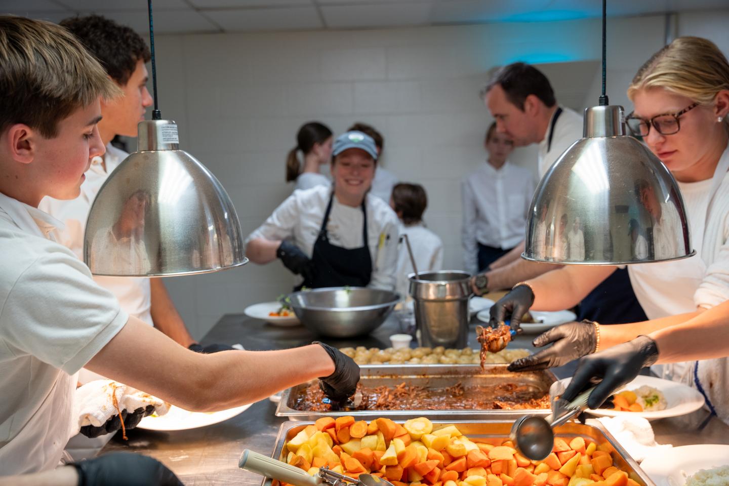 Change The World Kids Plating the Para La Tierra Dinner